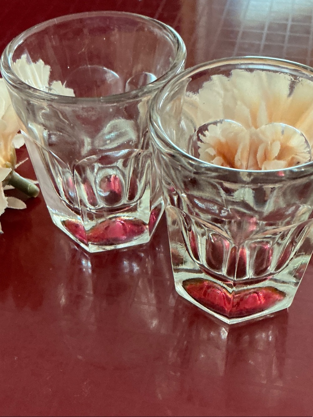 Set of Two vintage shot glasses with red bottoms. Hexagon panel shaped